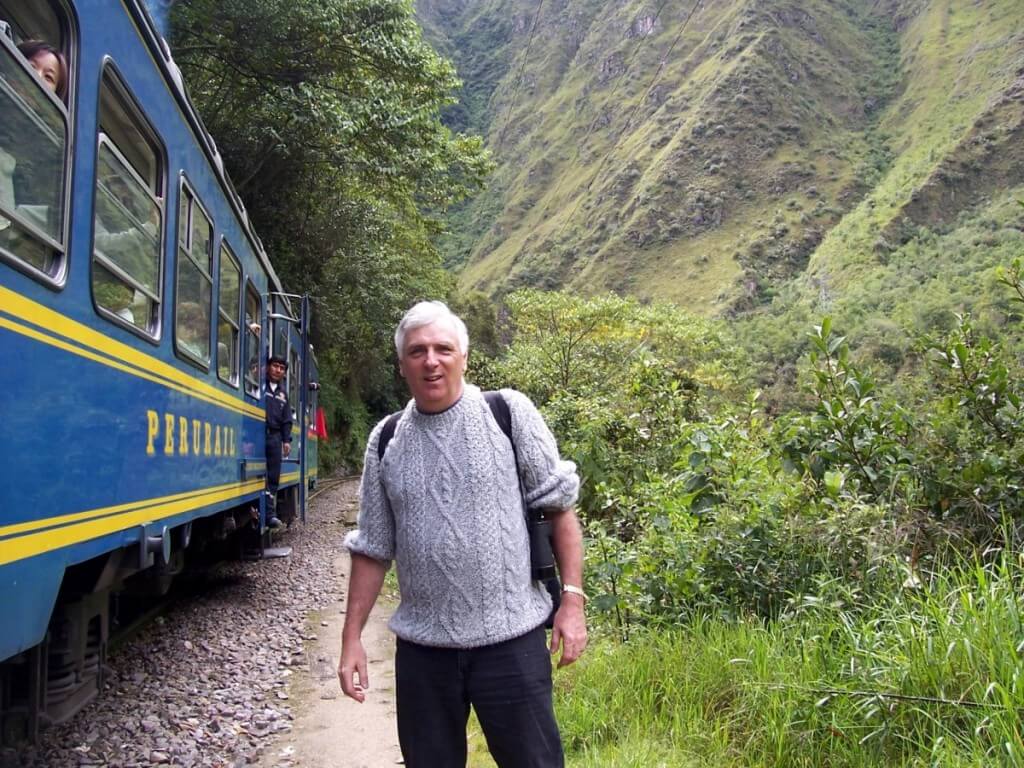 Bob exits PeruRail train at Chachabamba on the Inca Trail in Peru, South America