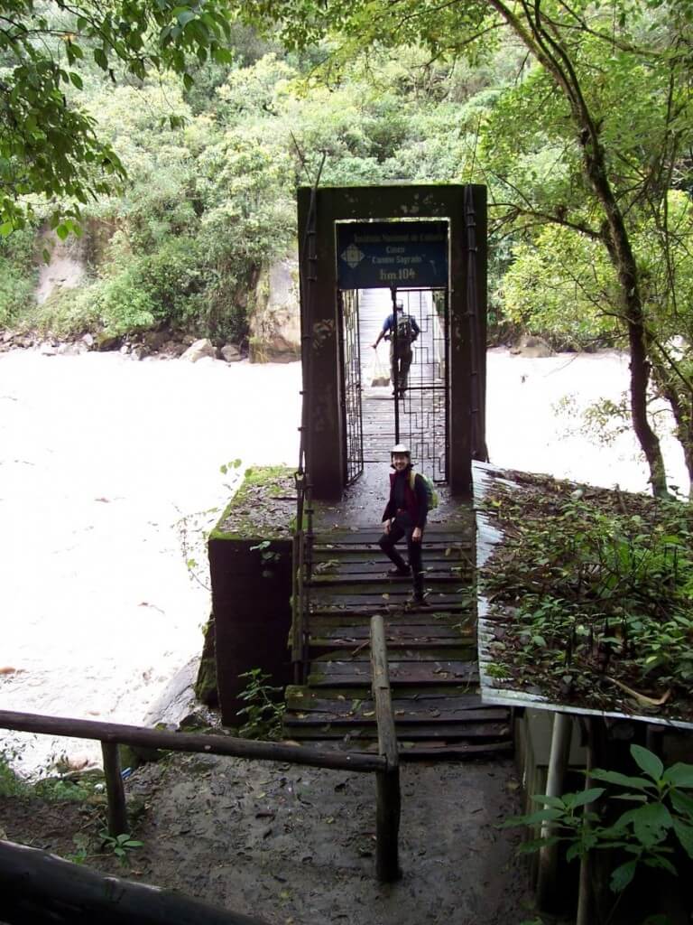 Jean on the steps of the Inca Trail control bridge over the Urubamba River in Peru, South America