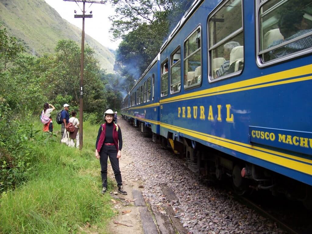 Jean exits PeruRail train at Chachabamba on the Inca Trail in Peru, South America