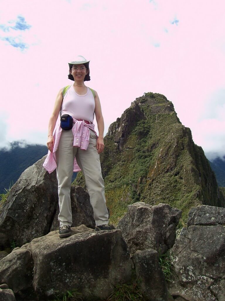 An image of Jean standing on top of Huchuy Picchu at Machu Picchu, Urubamba Province, Peru.