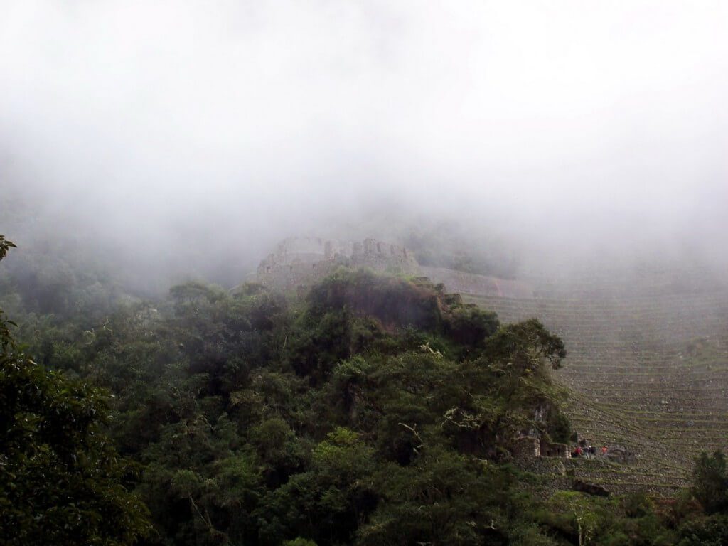 Mist and clouds over the Wiñay Wayna ruins in Peru, South America