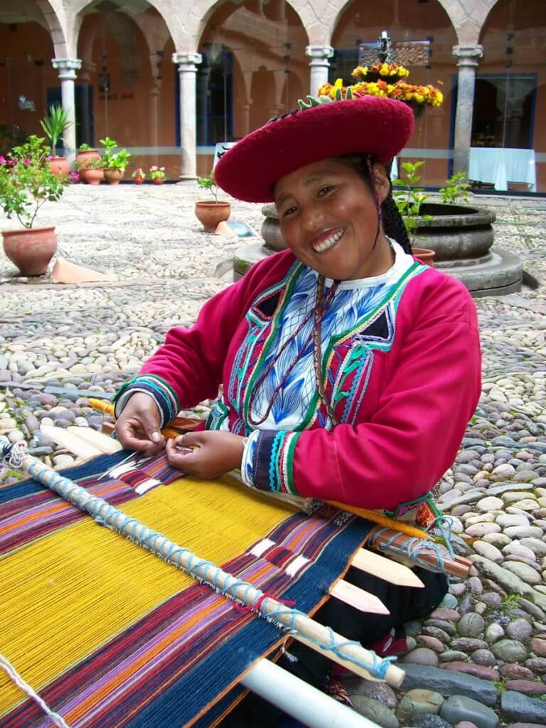 Cusco Woman prepares to weave at her backstrap loom