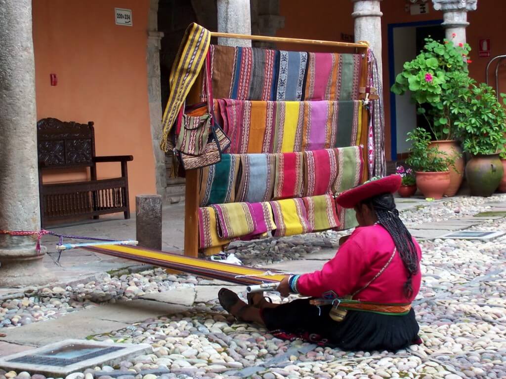 cusco woman weaving on her loom