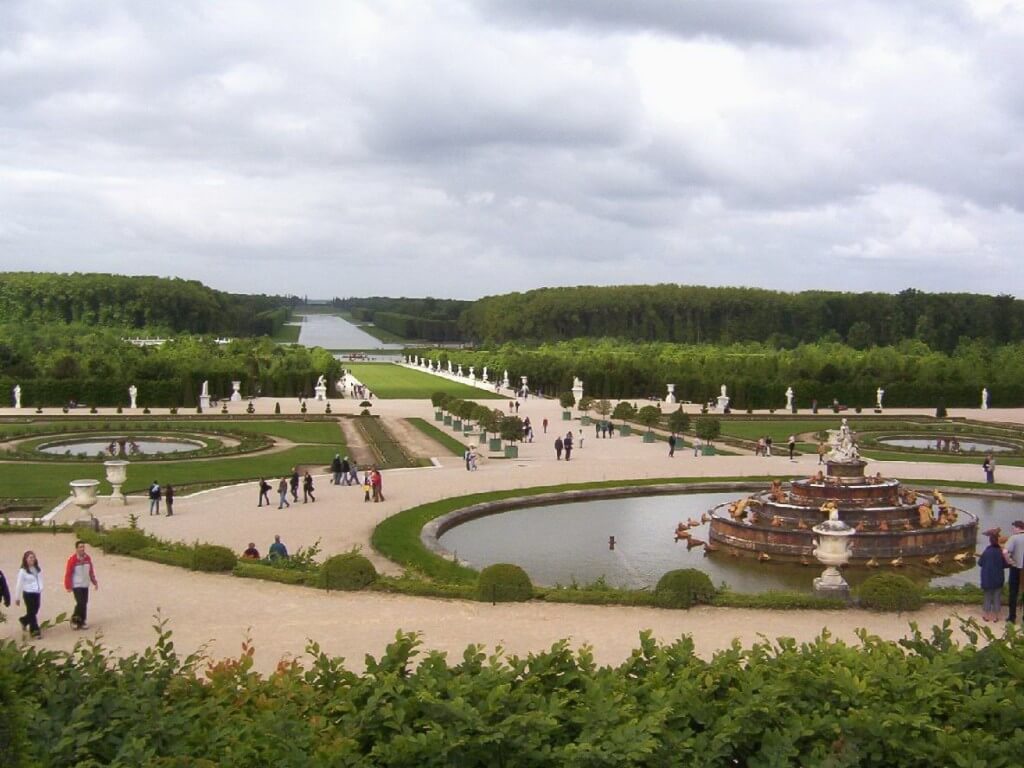 An image of the Latona Fountain and the Grand Canal at the Palace of Versailles in France.