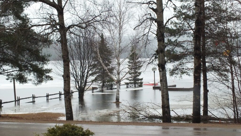 Oxtongue Lake flooding - flood land and fences into the lake - April 20 2013