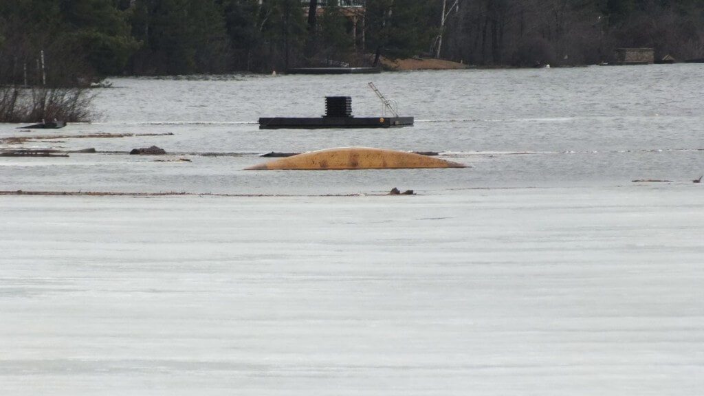 Oxtongue Lake flooding - sunken canoe and firewood adrift on lake - April 20 2013