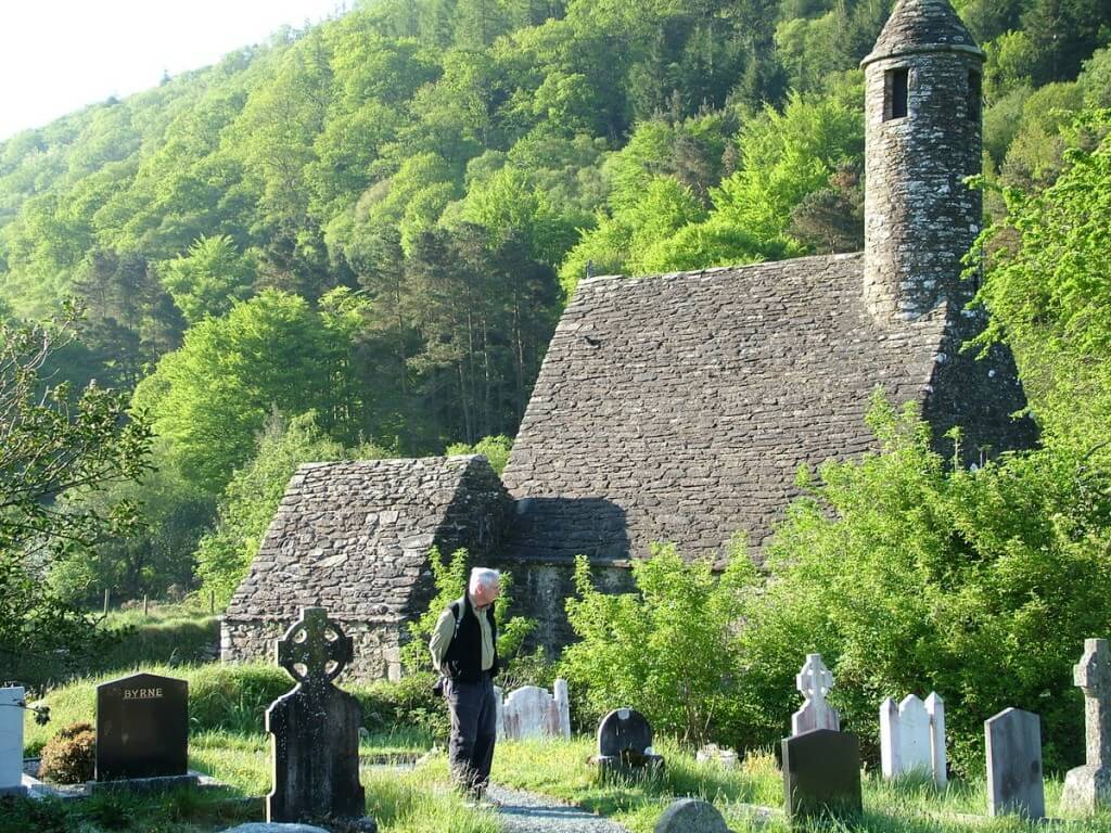 Bob checks out names in Glendalough Cathedral graveyard - Ireland