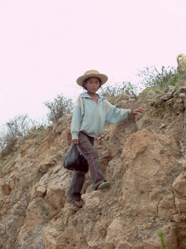 Young girl on a hillside near Nazca, Peru, South America