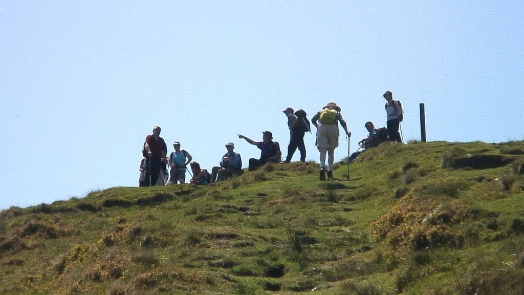 jean climbs final steps to top of mullacor mountain - wicklow - ireland