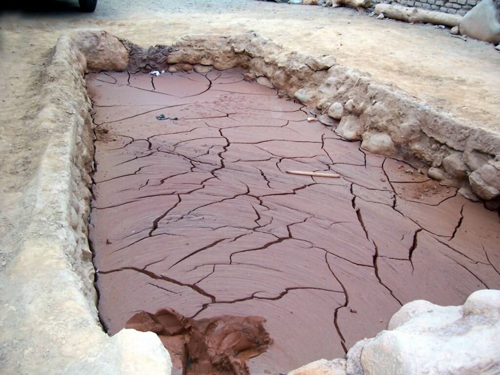 Vat of mud at gold processing plant in Nazca, Peru