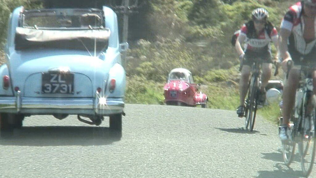 three wheel car and bikers