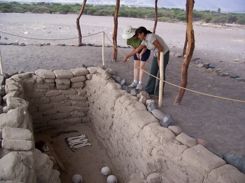 Jean views a burial plot at the Chauhilla Cemetery near Nazca in Peru, South America.