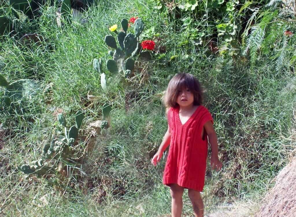 child in sand dune village - camana - peru