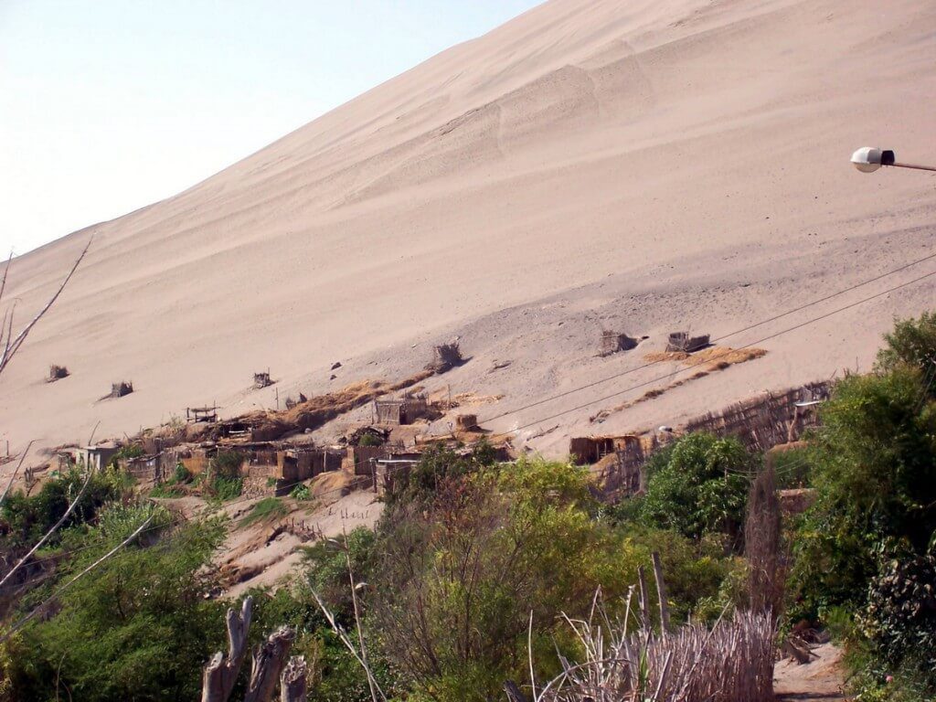 sand dune village near camana - peru