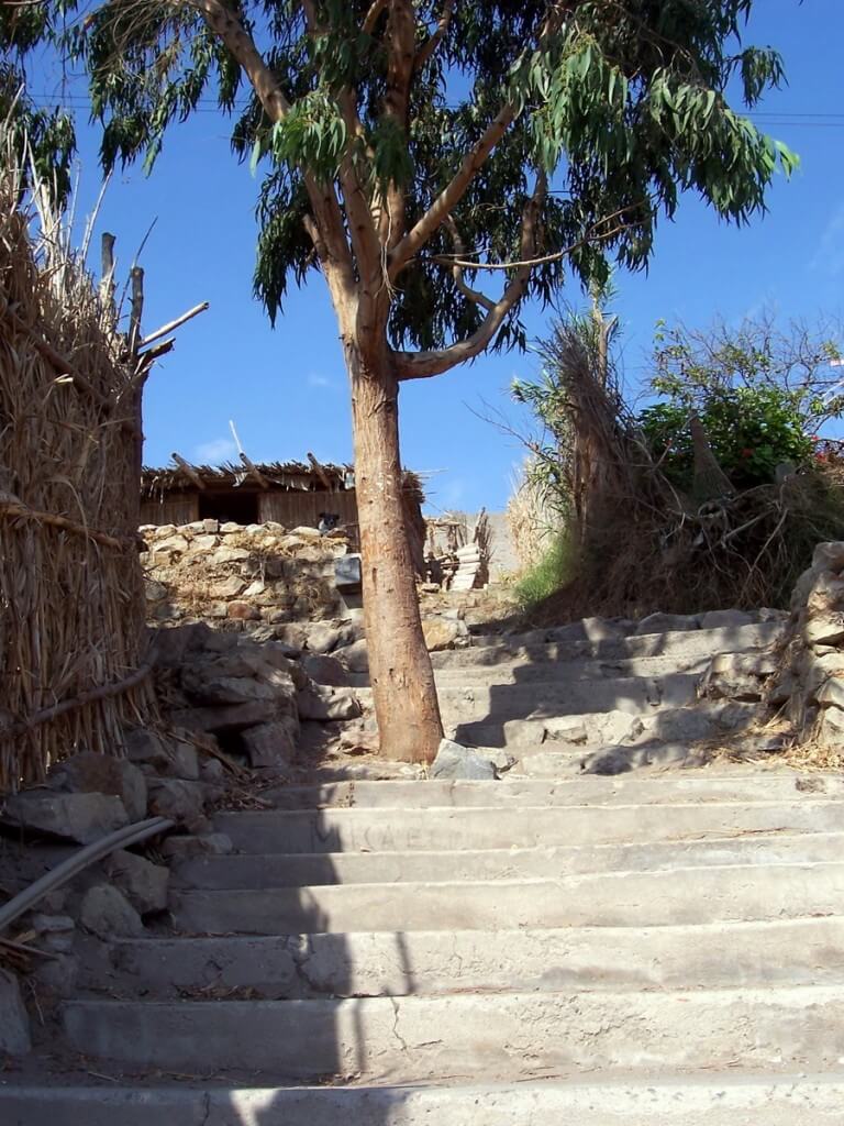 stone steps in sand dune village - camana - peru