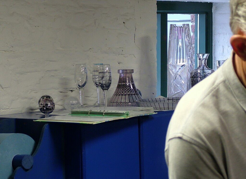 An image of various crystal objects with ink markings for cutting at the Waterford Crystal factory in Waterford, Ireland. Photography by Frame To Frame - Bob and Jean.