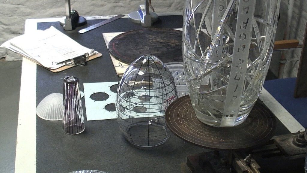 An image of various crystal objects with ink markings for cutting at the Waterford Crystal factory in Waterford, Ireland. Photography by Frame To Frame - Bob and Jean.