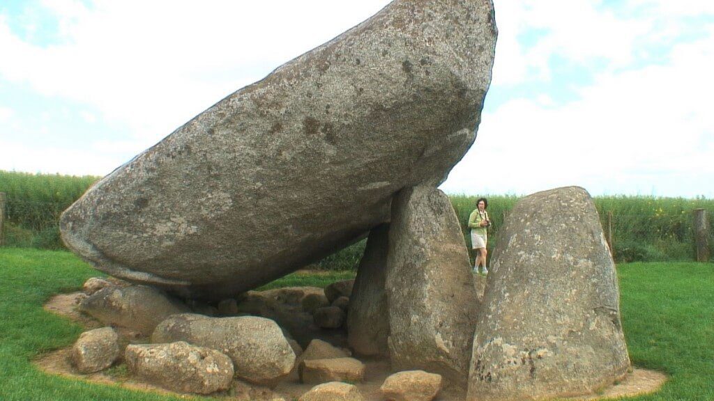 An image of Jean walking around the Brownshill Portal Tomb in County Carlow, Ireland. Photography by Frame To Frame - Bob and Jean.