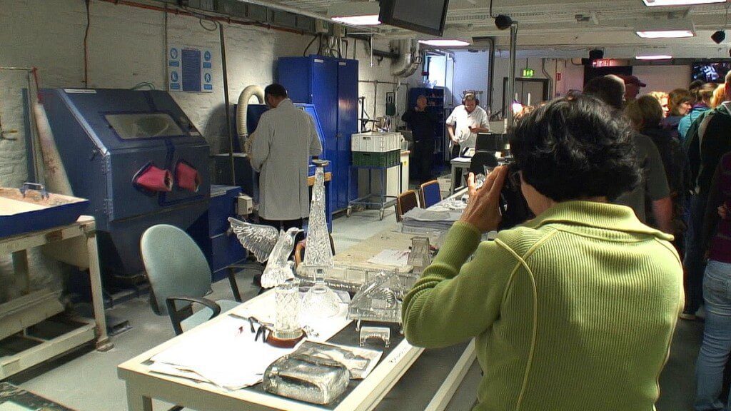 An image of Jean taking picture of various crystal objects at the Waterford Crystal factory in Waterford, Ireland