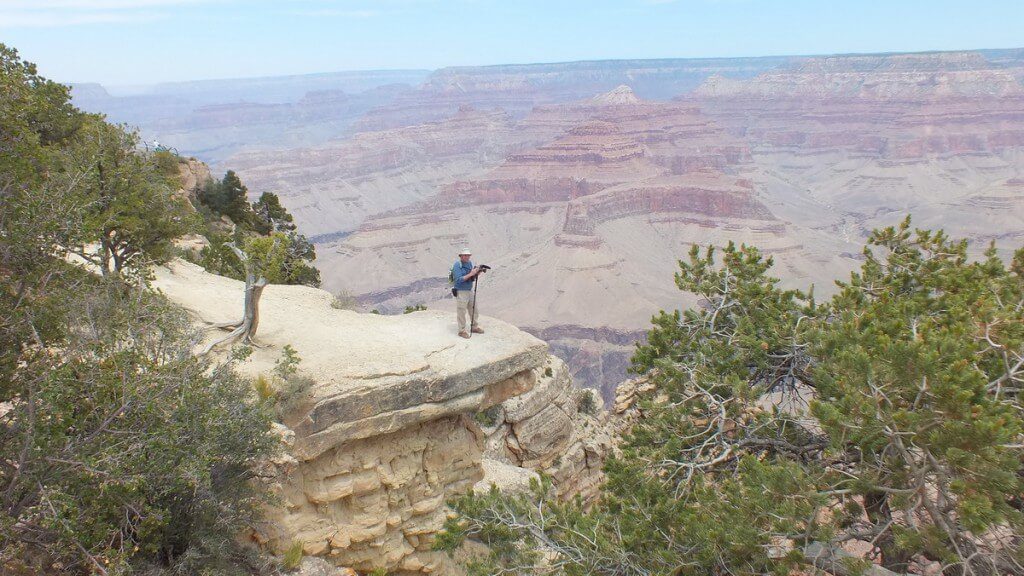 Bob stands on edge of South Rim - Grand Canyon