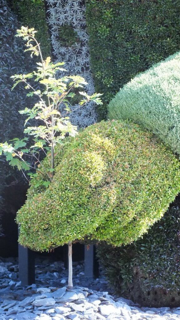 Close up of the hand of The Man Who Planted Trees topiary at Mosaiculture 2013 at Montreal Botancial Garden, Montreal, Quebec, Canada