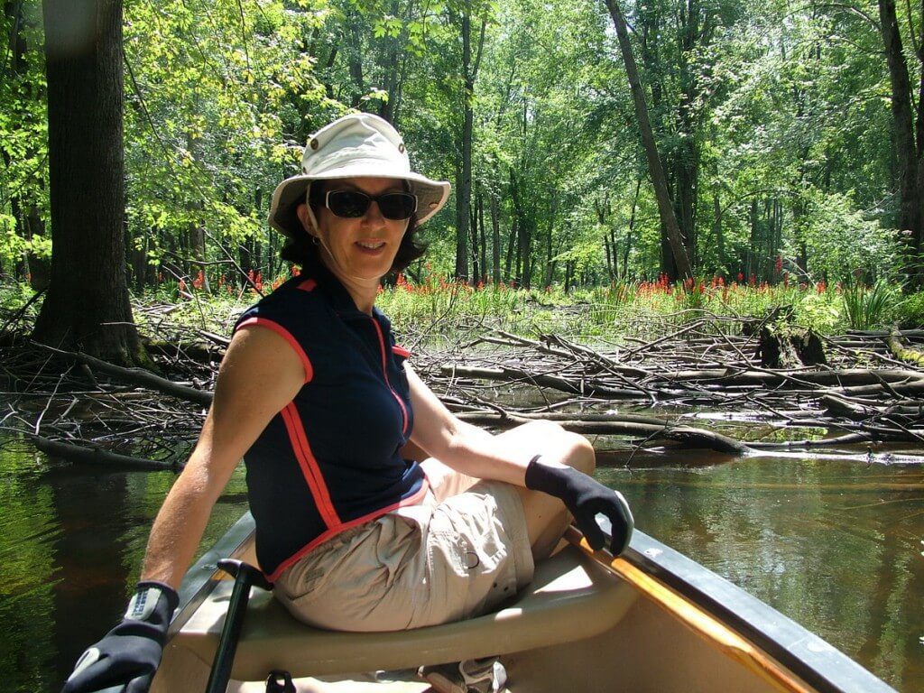 jean with cardinal flowers along nottawasaga river, ontario