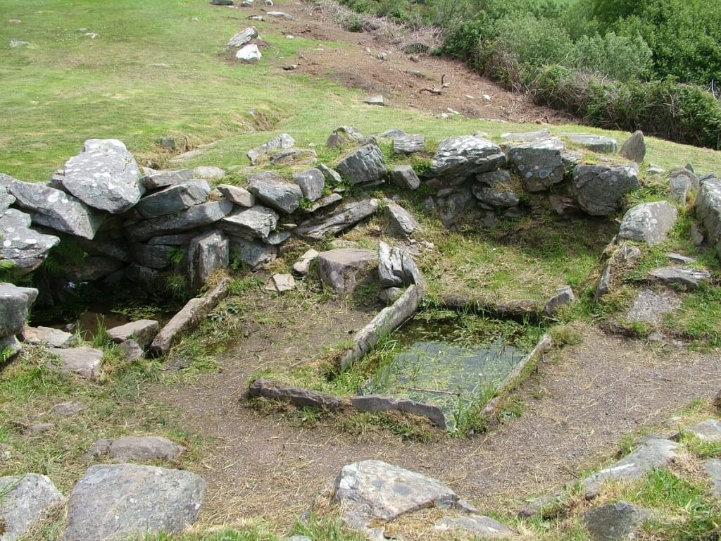 An image of the Fulacht Fiadh cooking place beside the Drombeg Stone Circle in County Cork, Ireland. Photography by Frame To Frame - Bob and Jean
