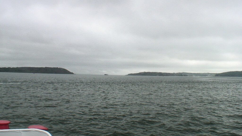 titanic's last anchorage spot, middle of picture where launch is located, off cobh town, county cork, ireland