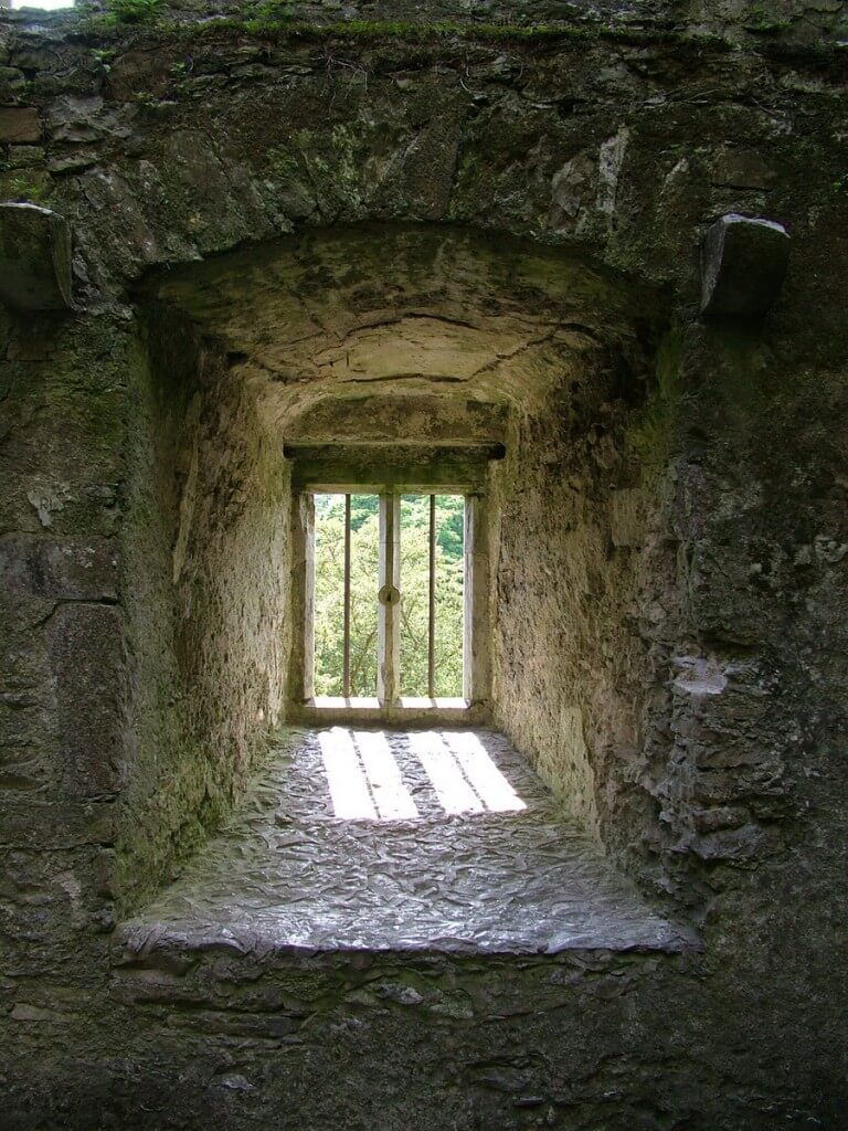 An image of a window in the wall of Blarney Castle near Cork in Ireland. Photography by Frame To Frame - Bob and Jean.