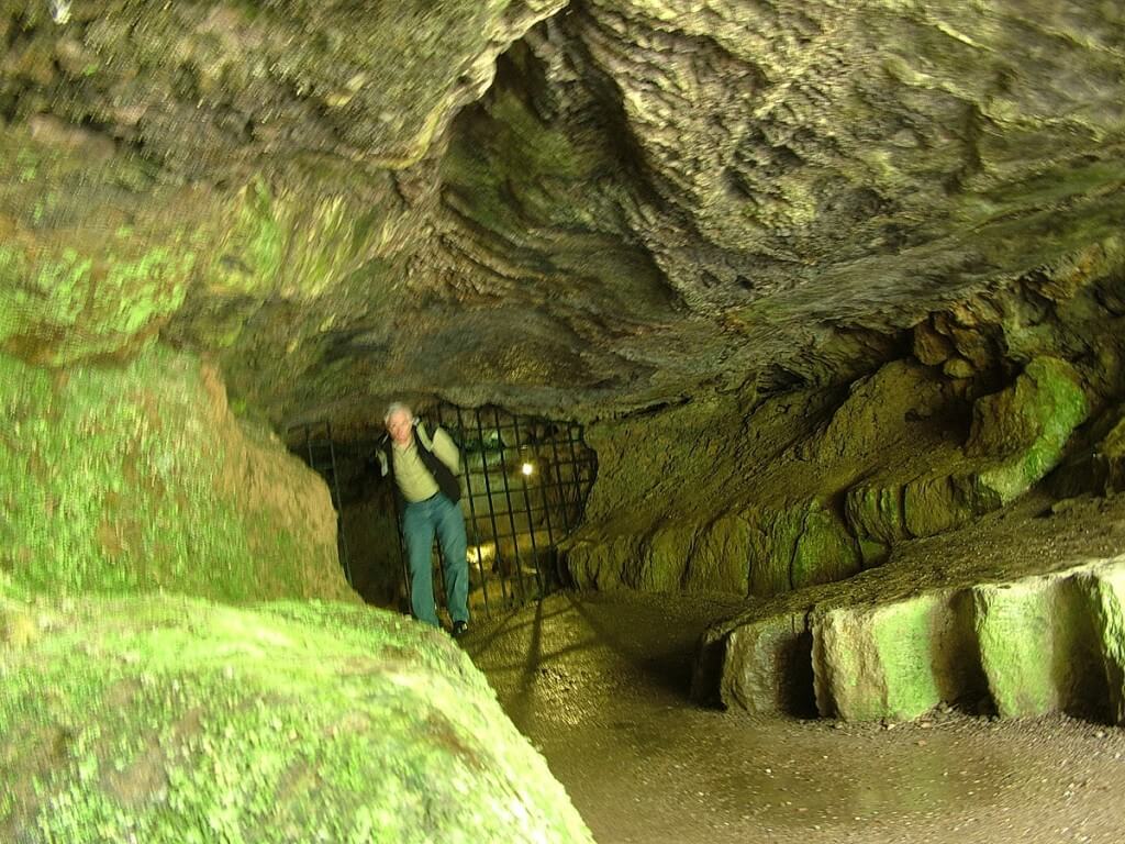 An image of Bob standing in Badger Cave at Blarney Castle in Ireland. Photography by Frame To Frame - Bob and Jean.