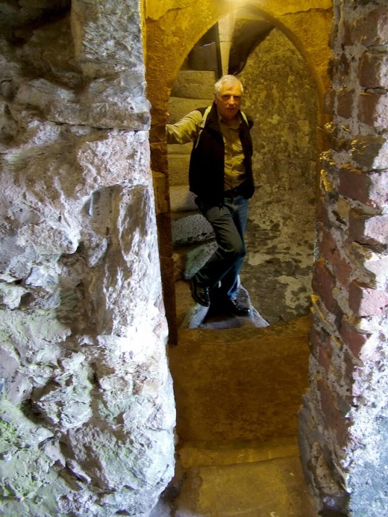An image of Bob climbing the stone steps in the Blarney Castle tower near Cork in Ireland. Photography by Frame To Frame - Bob and Jean.