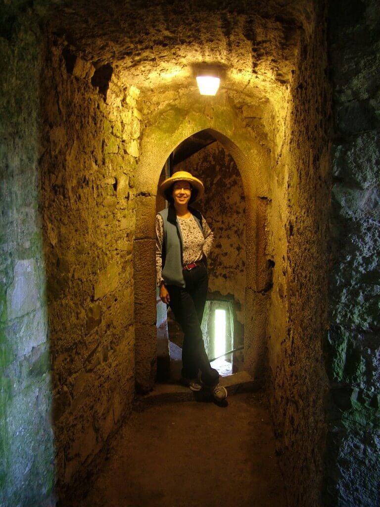 An image of Jean standing inside Blarney Castle near Cork in Ireland. Photography by Frame To Frame - Bob and Jean.