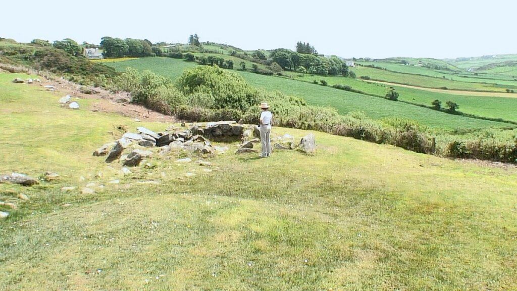 An image of Jean standing beside the Fulacht Fiadh cooking site near the Drombeg Stone Circle in County Cork, Ireland. Photography by Frame To Frame - Bob and Jean
