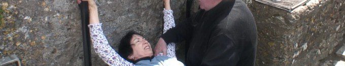 An image of Jean preparing to Kiss the Blarney Stone at Blarney Castle in Ireland. Photography by Frame To Frame - Bob and Jean.