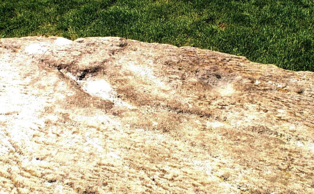 An image of a cup mark on the surface of the axial stone at the Drombeg Stone Circle in County Cork, Ireland. Photography by Frame To Frame - Bob and Jean.