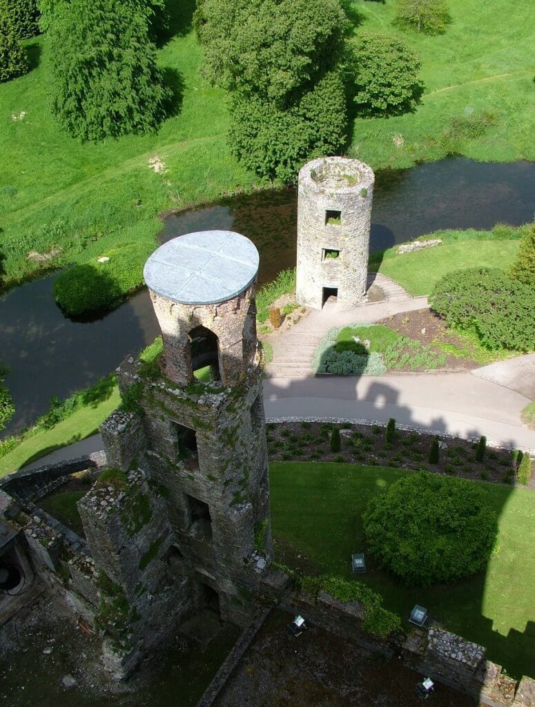 view of stone towers below at blarney castle, ireland