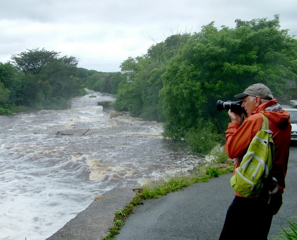 Bob films the Inagh river in Ennistymon, County Clare, Ireland