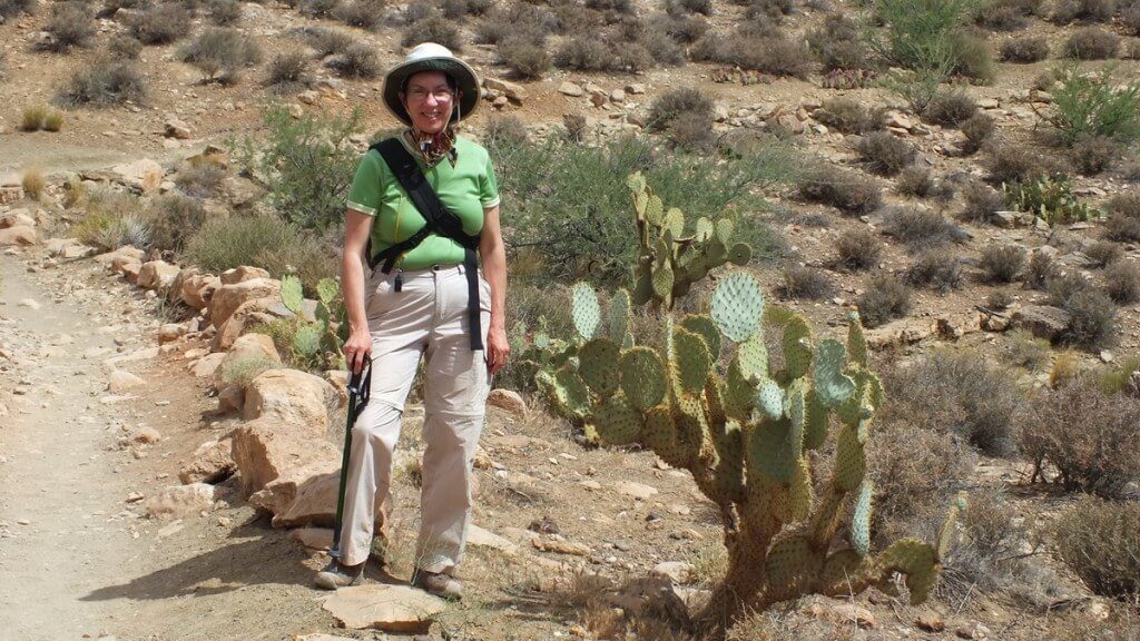 jean beside cactus growing along the hiking trail to Plateau Point at the Grand Canyon