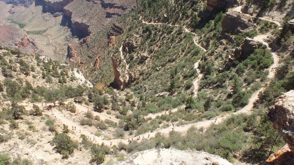 people hiking on the bright angel trail in the grand canyon