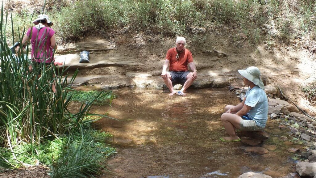 bob sitting at the tiny pond at indian garden in the grand canyon 