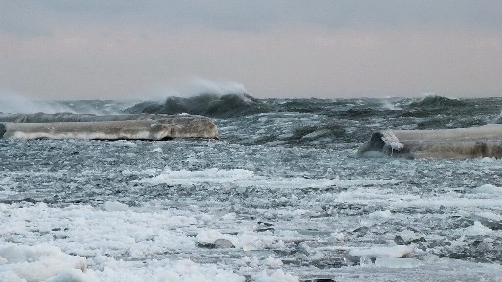 Icy waves breaking on Lake Ontario at Sunnyside in Toronto, Ontario, Canada