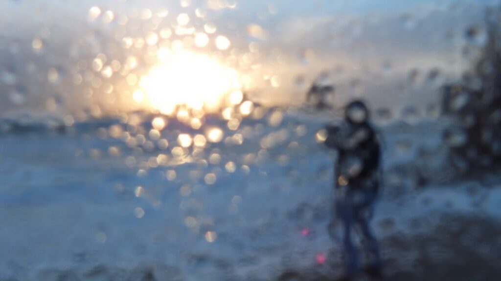 Camera lens covered in misty rain at Sunnyside on Lake Ontario in Toronto, Ontario, Canada