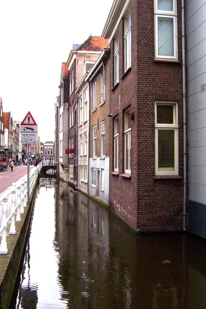 street scene beside canal, delft, the netherlands
