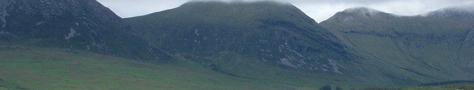 photograph of clouds over Muckanaght Mountain in the Twelve Bens in Ireland.