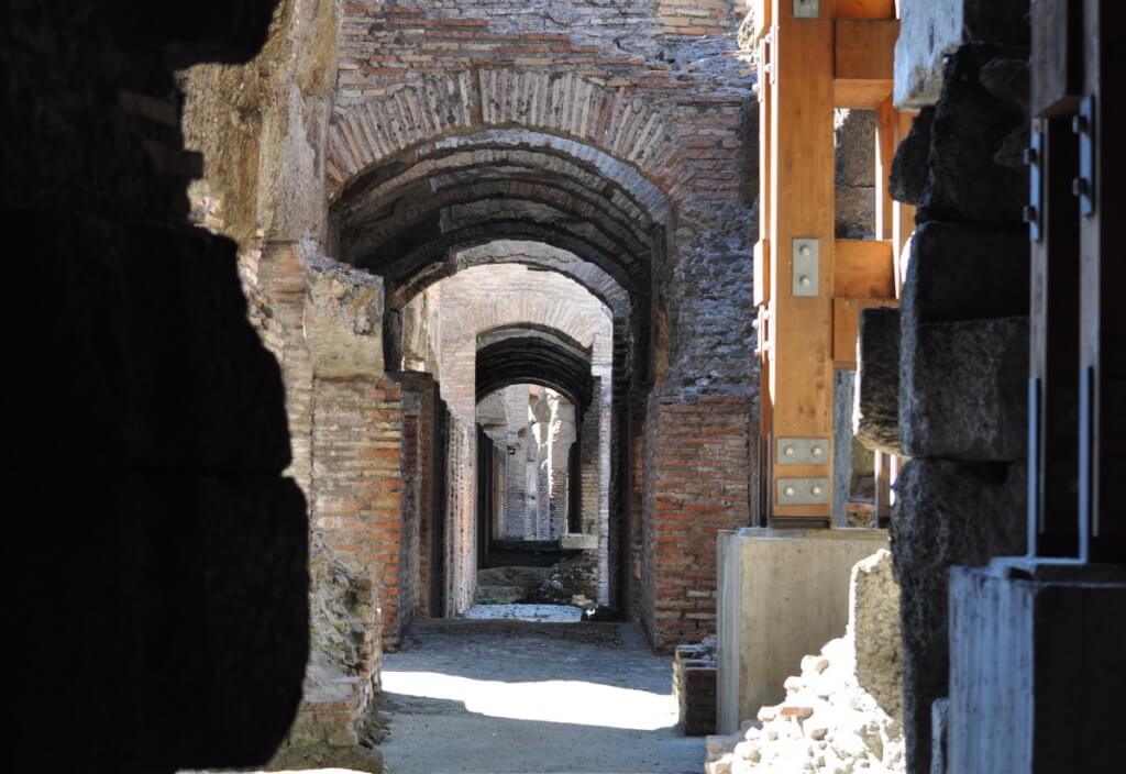 An image of the brick walls and archways in the underground of the Roman Colosseum, Rome, Italy. Photography by Frame To Frame - Bob and Jean.