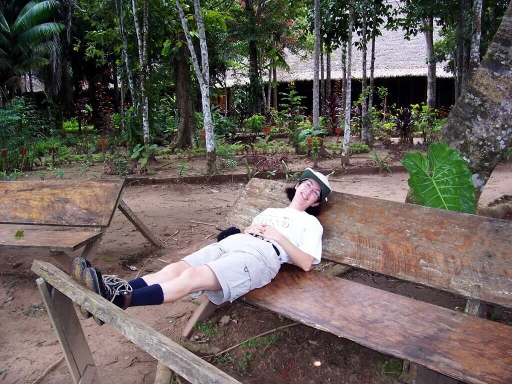 Jean sitting on a bench at Sandoval Lake Lodge, Lake Sandoval, Amazon Delta, Peru