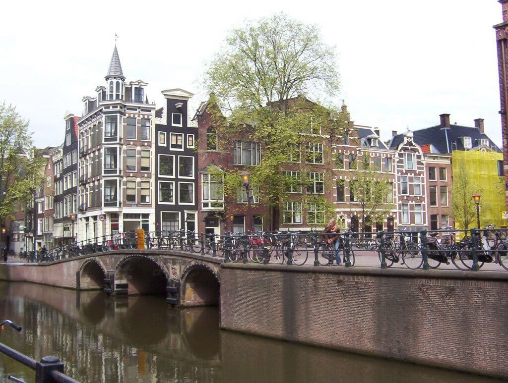 bikes on a canal bridge , amsterdam, the netherlands