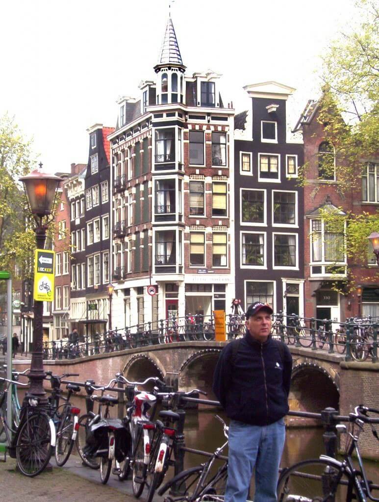 bikes on a canal bridge in amsterdam the netherlands