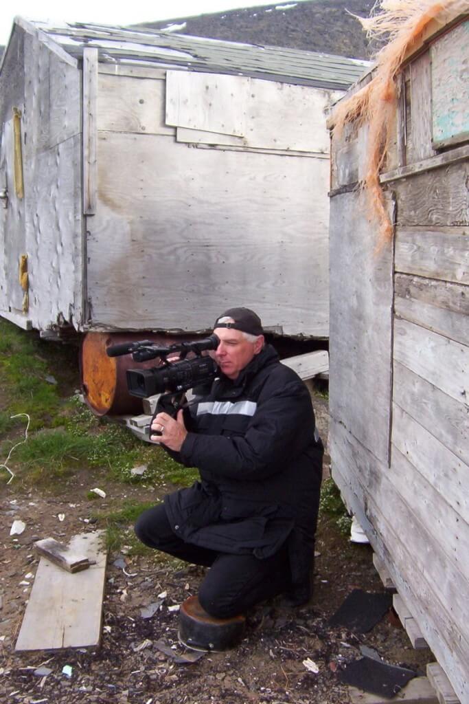 photograph of bob filming in the village of Pangnirtung on Baffin Island, Nunavut, Canada