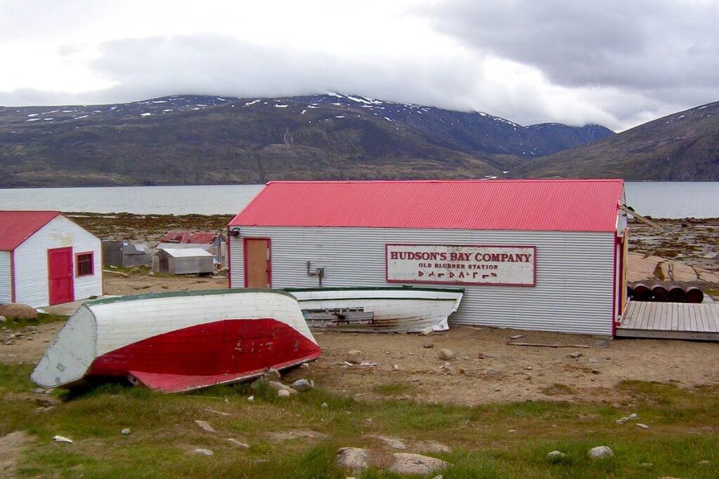 photograph of the former hudson's bay company blubber station buildings and boats in Pangnirtung on Baffin Island in Nunavut, Canada